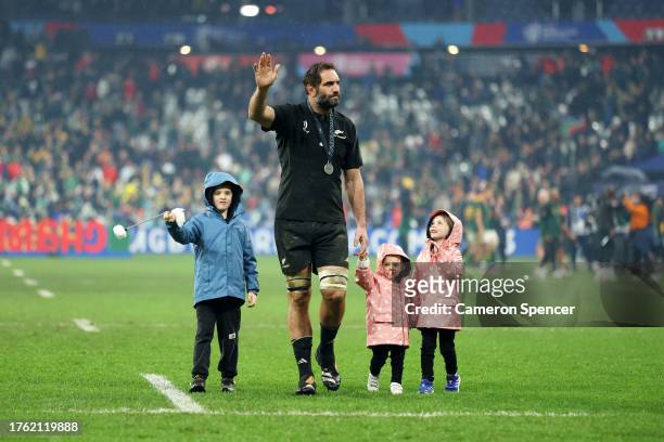 Samuel Whitelock of New Zealand acknowledges the fans with his children following defeat to South Africa during the Rugby World Cup Final match...