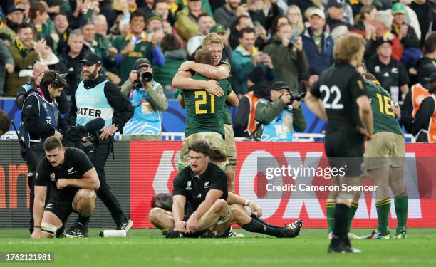 Pieter-Steph Du Toit and Kwagga Smith of South Africa celebrate victory a full-time following the Rugby World Cup Final match between New Zealand and...