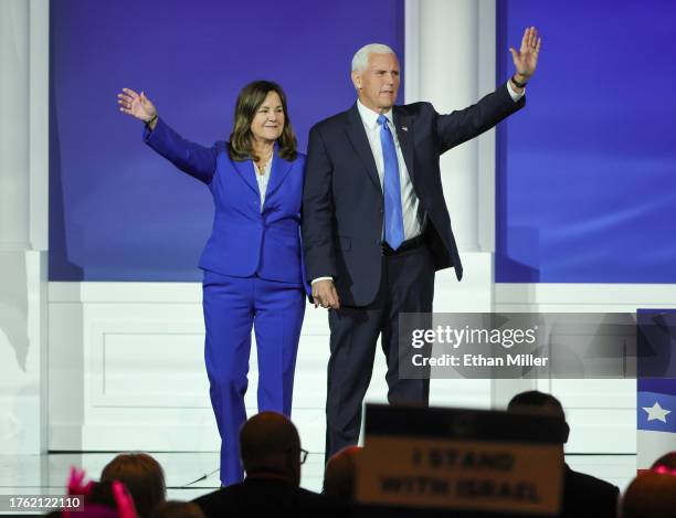 Karen Pence and former U.S. Vice President Mike Pence wave as they leave the stage after he suspended his campaign for president during the...