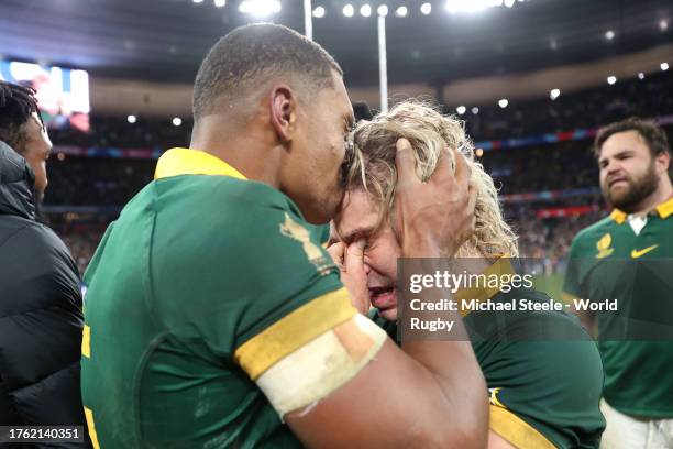 Damian Willemse and Faf de Klerk of South Africa celebrate victory at full-time following the Rugby World Cup Final match between New Zealand and...