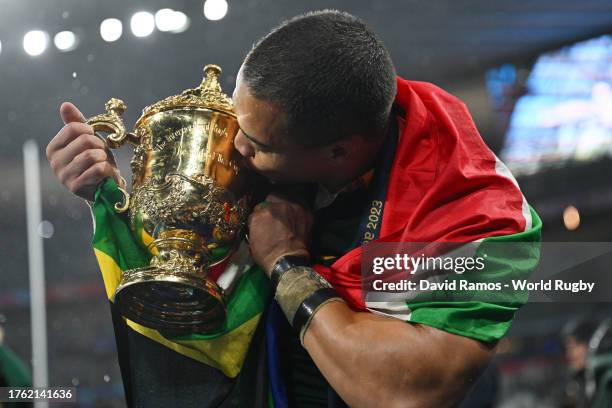 Cheslin Kolbe of South Africa kisses the The Webb Ellis Cup following during the Rugby World Cup Final match between New Zealand and South Africa at...