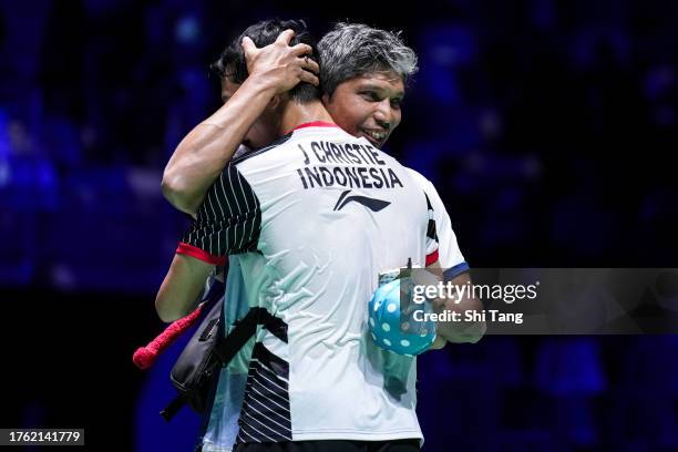 Jonatan Christie of Indonesia celebrates the victory with his coach in the Men's Singles Semi-Finals match against Loh Kean Yew of Singapore during...