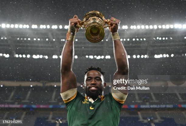 Siya Kolisi of South Africa celebrates with the The Webb Ellis Cup following the Rugby World Cup Final match between New Zealand and South Africa at...