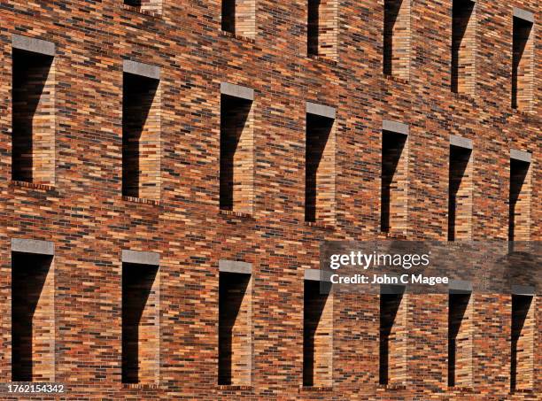 brick repetition - midday stock pictures, royalty-free photos & images
