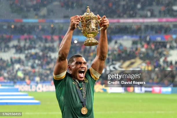 Damian Willemse of South Africa celebrates with The Webb Ellis Cup following the Rugby World Cup Final match between New Zealand and South Africa at...