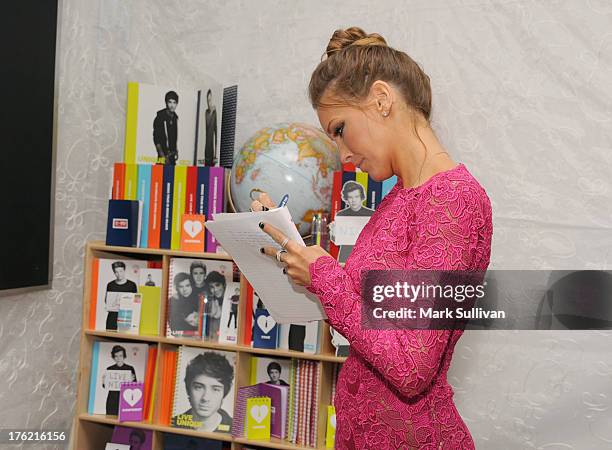 Actress Katie Cassidy attends the Backstage Creations Celebrity Retreat At Teen Choice 2013 at Gibson Amphitheatre on August 11, 2013 in Universal...