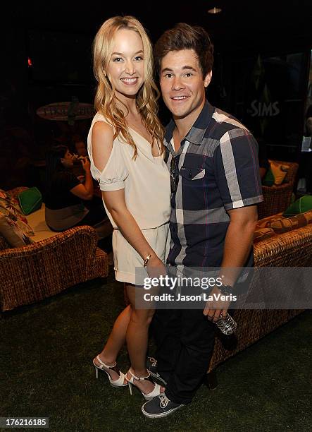 Actor Adam DeVine and guest pose in the green room at the 2013 Teen Choice Awards at Gibson Amphitheatre on August 11, 2013 in Universal City,...