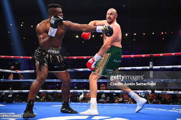 Francis Ngannou punches Tyson Fury during the Heavyweight fight between Tyson Fury and Francis Ngannou at Boulevard Hall on October 28, 2023 in...