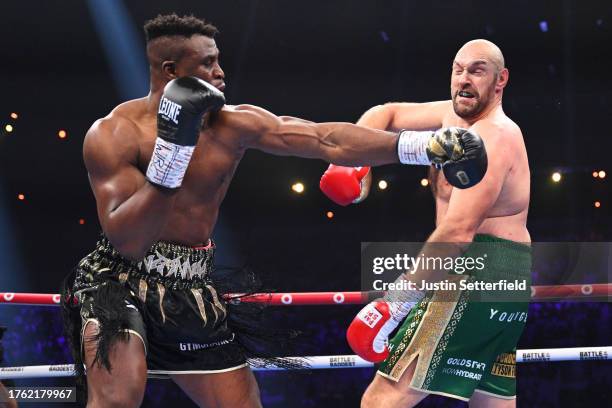 Francis Ngannou punches Tyson Fury during the Heavyweight fight between Tyson Fury and Francis Ngannou at Boulevard Hall on October 28, 2023 in...