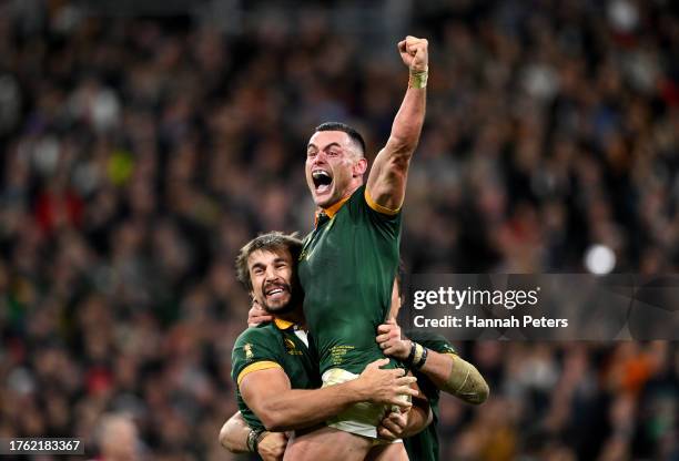 Eben Etzebeth and Jesse Kriel of South Africa celebrate victory at full-time following the Rugby World Cup Final match between New Zealand and South...
