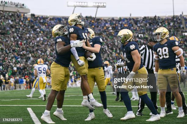 Ramon Henderson of the Notre Dame Fighting Irish celebrates with teammates after his touchdown in the second half against the Pittsburgh Panthers at...