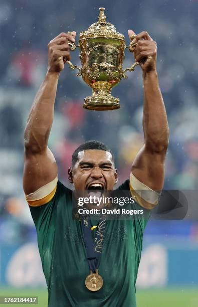 Damian Willemse of South Africa celebrates with the The Webb Ellis Cup following the team’s victory in the Rugby World Cup Final match between New...