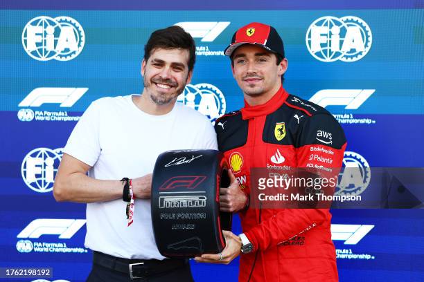 Pole position qualifier Charles Leclerc of Monaco and Ferrari is presented with the Pirelli Pole Position Award. By Jimmy Alvarez in parc ferme...