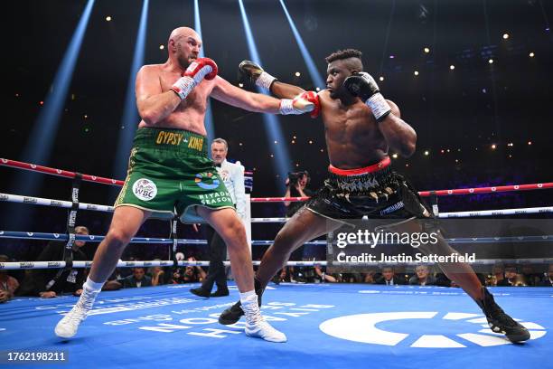 Tyson Fury and Francis Ngannou exchange punches during the Heavyweight fight between Tyson Fury and Francis Ngannou at Boulevard Hall on October 28,...