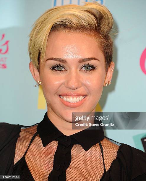 Miley Cyrus poses at the 2013 Teen Choice Awards at Gibson Amphitheatre on August 11, 2013 in Universal City, California.