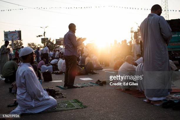 Supporters of deposed Egyptian President Mohammed Morsi perform morning prayer at sunrise during a sit-in demonstration near the Rabaa al-Adweya...
