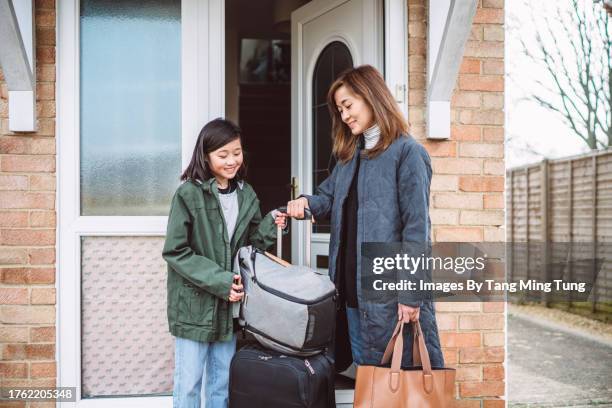 mom & daughter leaving home with luggages to go on for vacation - teen packing suitcase stock pictures, royalty-free photos & images