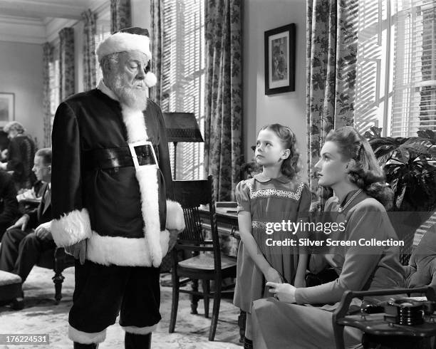 Edmund Gwenn as Kris Kringle, Natalie Wood as Susan Walker and Maureen O'Hara as Doris Walker in 'Miracle On 34th Street', written and directed by...