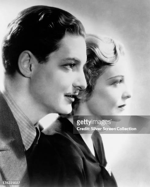 English actors Robert Donat and Madeleine Carroll in a promotional portrait for 'The 39 Steps', directed by Alfred Hitchcock, 1935.