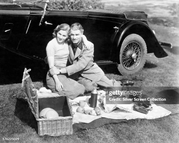 British actors Laurence Olivier , as Maxim de Winter, and Joan Fontaine as The Second Mrs. De Winter in 'Rebecca', directed by Alfred Hitchcock, 1940.