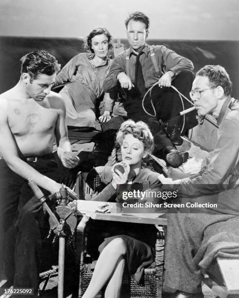 Publicity still for 'Lifeboat', directed by Alfred Hitchcock, 1944. The cast are John Hodiak , Mary Anderson, Hume Cronyn , Henry Hull and Tallulah...