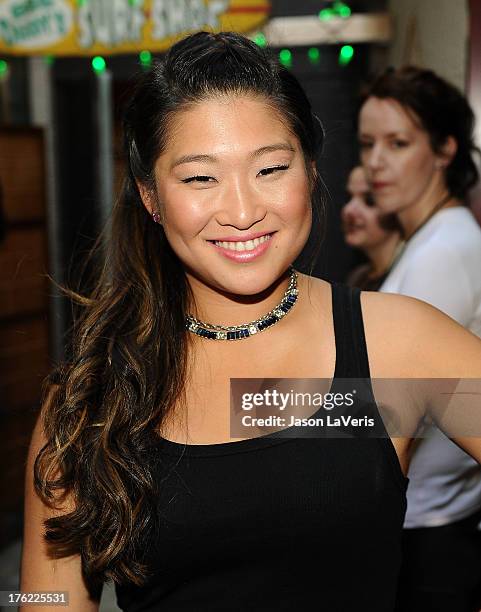 Actress Jenna Ushkowitz poses in the green room at the 2013 Teen Choice Awards at Gibson Amphitheatre on August 11, 2013 in Universal City,...