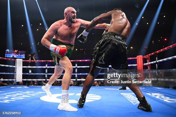 Tyson Fury punches Francis Ngannou during the Heavyweight fight between Tyson Fury and Francis Ngannou at Boulevard Hall on October 28, 2023 in...