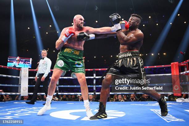 Tyson Fury punches Francis Ngannou during the Heavyweight fight between Tyson Fury and Francis Ngannou at Boulevard Hall on October 28, 2023 in...