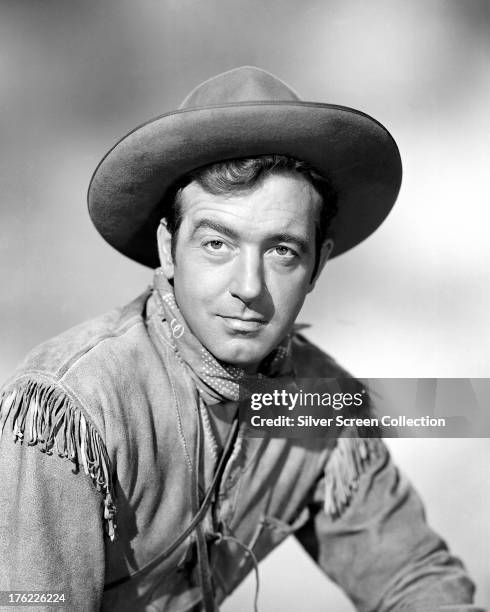 American actor John Payne wearing a buckskin jacket, circa 1950.