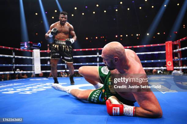 Francis Ngannou knocks down Tyson Fury during the Heavyweight fight between Tyson Fury and Francis Ngannou at Boulevard Hall on October 28, 2023 in...