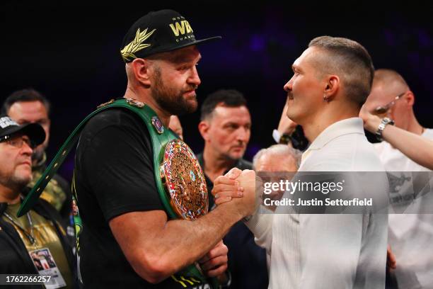 Tyson Fury and Oleksandr Usyk shake hands after the Heavyweight fight between Tyson Fury and Francis Ngannou at Boulevard Hall on October 28, 2023 in...