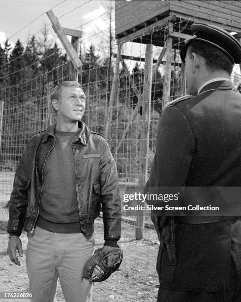 Steve McQueen as Captain Virgil Hilts and Hannes Messemer as Col. Von Luger in 'The Great Escape', directed by John Sturges, 1963.