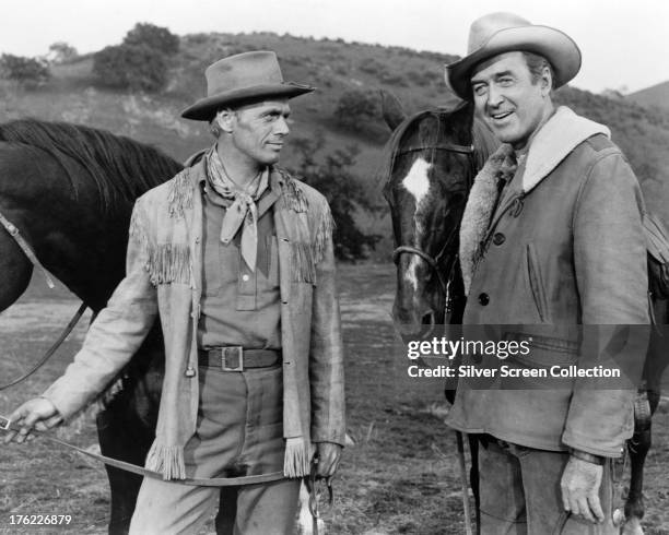 American actors Richard Widmark as First Lt. Jim Gary, and James Stewart as Marshal Guthrie McCabe, in 'Two Rode Together', directed by John Ford,...