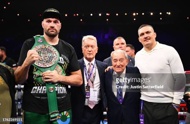 Tyson Fury, Frank Warren, Boxing promoter of Queensberry boxing, Bob Arum, Boxing promoter of Top Rank Boxing and Oleksandr Usyk pose for a photo...