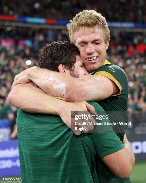 Frans Malherbe and Pieter-Steph Du Toit of South Africa embrace at full-time following the Rugby World Cup Final match between New Zealand and South...
