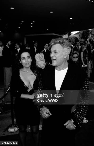 Lisa Deutsch and Tony Curtis attend the premiere of "True Lies" in Westwood, California, on July 15, 1994.