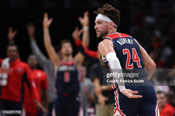 Corey Kispert of the Washington Wizards celebrates after scoring against the Memphis Grizzlies during the first half at Capital One Arena on October...