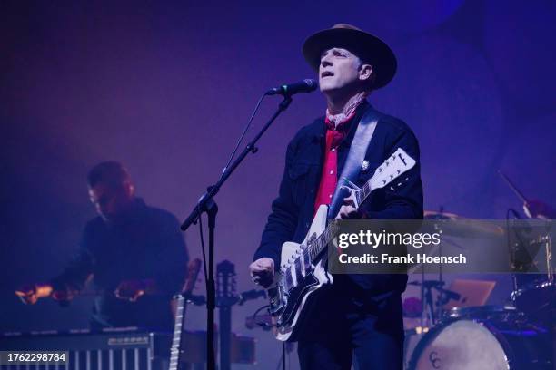 Singer Joey Burns of the American band Calexico performs live on stage during a concert at the Theater des Westens on October 28, 2023 in Berlin,...