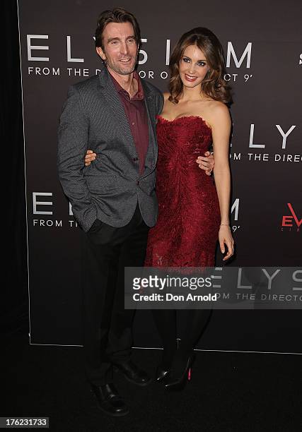 Sharlto Copley and Tanit Phoenix arrive for the Australian Premiere of "Elysium" on August 12, 2013 in Sydney, Australia.
