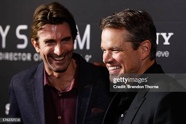 Matt Damon and Sharlto Copley arrives for the "Elysium" Australian premiere at Event Cinemas, George Street on August 12, 2013 in Sydney, Australia.