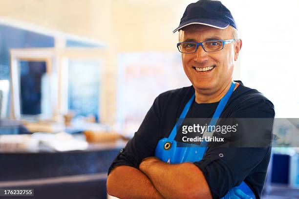 happy fishmonger smiling - fishmonger stock pictures, royalty-free photos & images