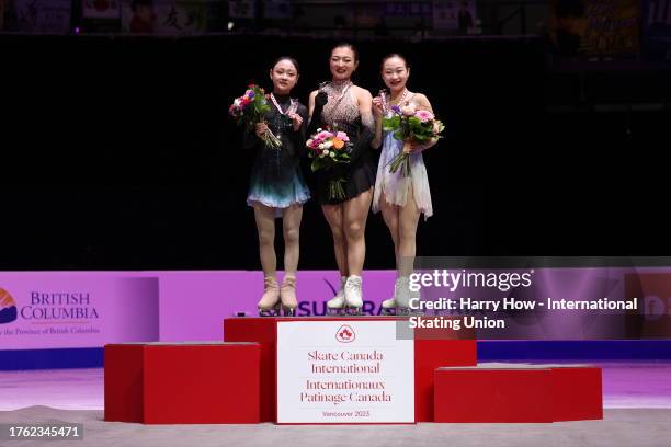 Chaeyeon Kim of South Korea with the silver medal, Kaori Sakamoto of Japan with the gold medal and Rino Matsuike of Japan with the bronze medal stand...