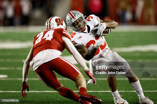 TreVeyon Henderson of the Ohio State Buckeyes rushes the ball during the second quarter against the Wisconsin Badgers at Camp Randall Stadium on...