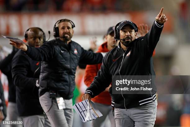 Ryan Day head coach of the Ohio State Buckeyes reacts to a penalty during the second quarter against the Wisconsin Badgers at Camp Randall Stadium on...