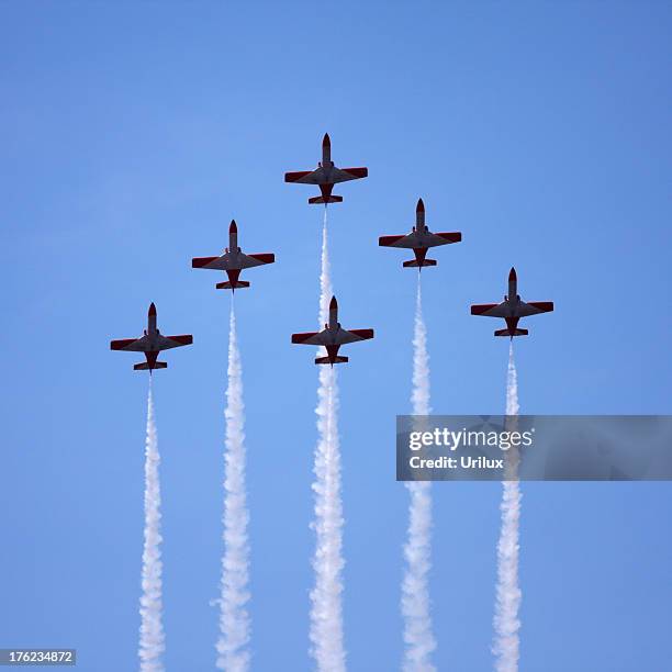 spanish air force aerobatics team performing a a fly-past in 'arrow-head' formation at the karup airshow - airshow stockfoto's en -beelden