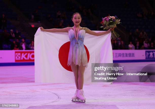 Rino Matsuike of Japan poses with the bronze medal and flag after the Women Free Skating during the ISU Grand Prix of Figure Skating - Skate Canada...
