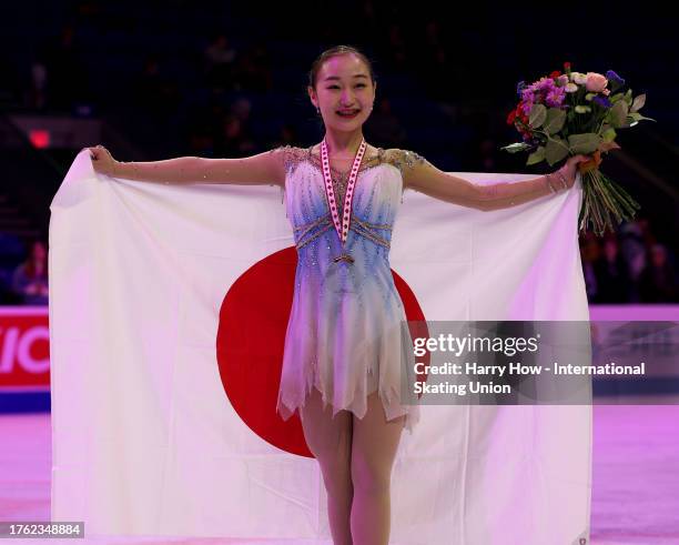 Rino Matsuike of Japan poses with the bronze medal and flag after the Women Free Skating during the ISU Grand Prix of Figure Skating - Skate Canada...