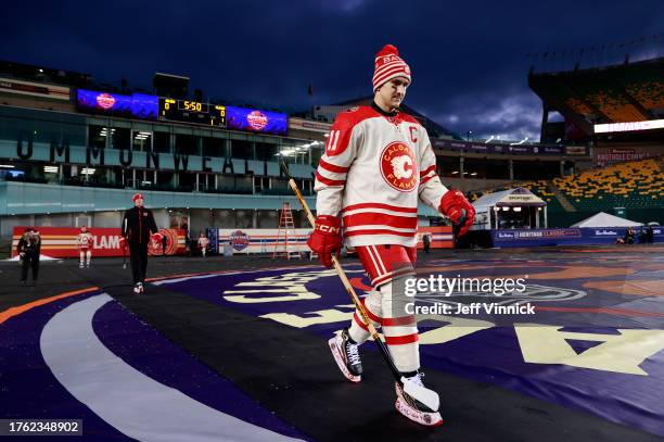 Mikael Backlund of the Calgary Flames and his teammates make their way to the ice surface before practice at Commonwealth Stadium on October 28, 2023...