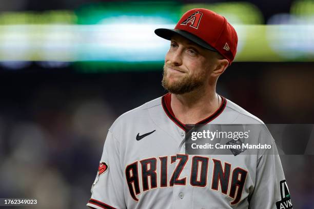 Merrill Kelly of the Arizona Diamondbacks walks across the field after the fifth inning against the Texas Rangers during Game Two of the World Series...