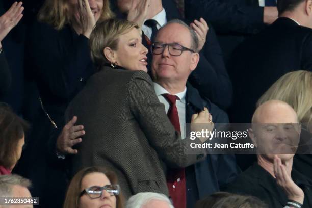 Princess Charlene of Monaco celebrates the victory by hugging Prince Albert II of Monaco at full time following the Rugby World Cup France 2023 Final...